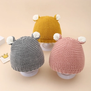 Three-piece set of knit baby hats with bear ears in yellow, grey, and pink colors