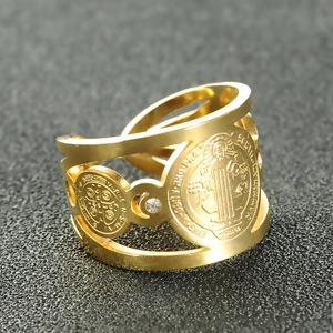 Detail of gold Saint Benedict open ring featuring hollow design and zircon accents