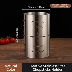 Macro view of a 16cm height silver stainless steel chopstick holder with hollow patterns