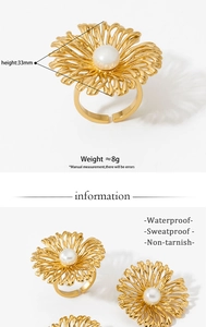 Detail view of gold daisy flower ring with pearl and dimensions for height and weight