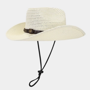Close-up of cream woven straw cowboy hat with leather band and metal buckle detailing