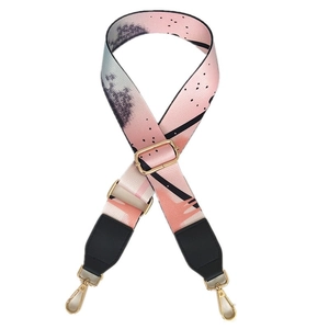 Colorful wide shoulder strap for bags with ethnic abstract pattern and gold metal hooks