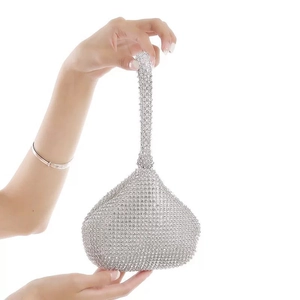 Sparkling teardrop-shaped evening clutch bag with full rhinestone embellishment
