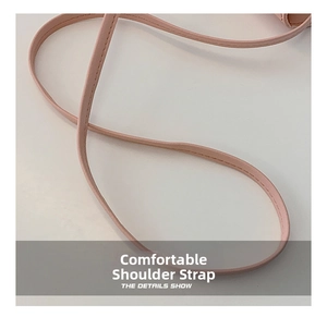 Detail view of pink leather strap with precise stitching for kids crossbody bag