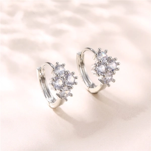 Elegant silver s925 drop earrings featuring a cluster of three sparkling white zircons
