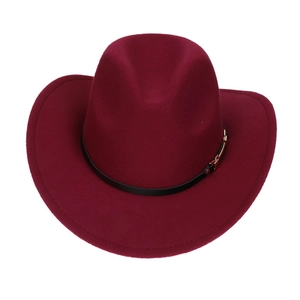 Top-down view of wine red felt cowboy hat with black leather band and gold hardware detail