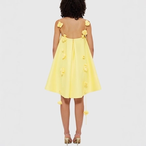 Chic yellow mini dress with 3D floral accents and spaghetti straps, back view