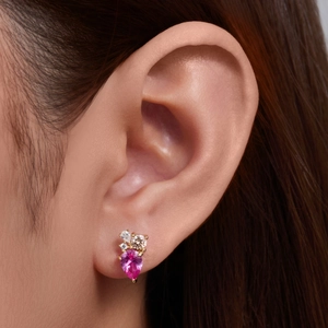 Classic silver earrings with pear-cut pink zircon and champagne stones on ear