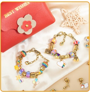 Detailed view of colorful beaded bracelets with star pendants and a red gift pouch
