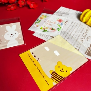 Detail of cute bear and rabbit cartoon self-adhesive OPP treat bags for cookies and candy