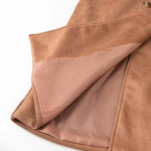 Detail of the brown suede fabric coat with smooth satin lining and premium stitching