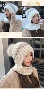 Detail of knitted winter hood scarf with fluffy pompom in light oatmeal color