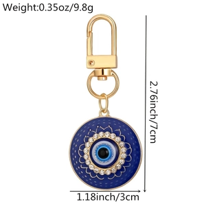 Detail view of Evil Eye heart keychain with blue enamel and sparkling rhinestones