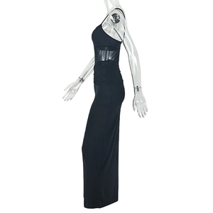Detail of black slim fit maxi dress featuring mesh paneling and side ruched waist texture