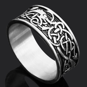 Close-up of vintage silver Thor hammer ring with Nordic runes and Celtic knot reliefs
