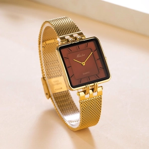 Detail shot of the square gold mesh strap quartz watch with minimalist brown dial face