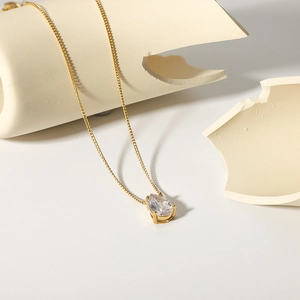 Gold-plated stainless steel necklace featuring a pear-cut white zircon teardrop pendant