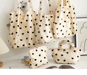 Heart pattern textured canvas bags in various sizes, including tote and pouch styles