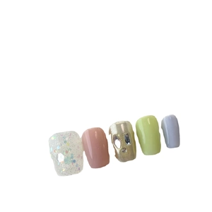 Handmade press-on nails with candy macaron colors, glitter sequins, and rhinestone accents