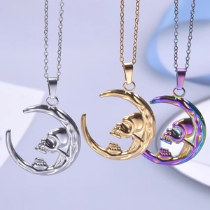 Three celestial moon skull pendant necklaces in silver, gold, and rainbow metallic finishes