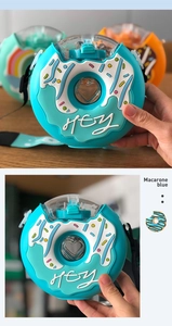 Detail of macaron blue donut water bottle with clear lid and portable shoulder strap