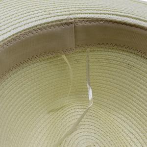 Macro detail of panama straw hat interior with adjustable sweatband and woven texture