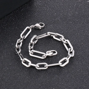 Detailed view of silver stainless steel paperclip chain bracelet with lobster clasp