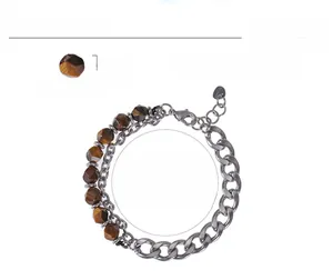 Detail of 8mm faceted tiger eye stone beads and stainless steel Cuban link chain jewelry