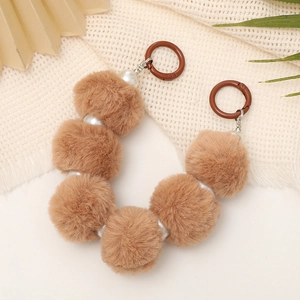 Brown pompom and white pearl charm chain with silver metal rings and large brown clasps