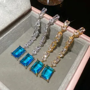 Elegant 18K gold plated silver drop earrings with blue square zircon and shimmering stones