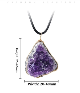 Macro shot of handmade amethyst cluster pendant with gold wire wrap and 25-40mm size detail