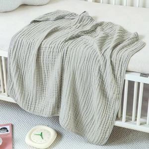 Detailed texture of soft light green 6-layer cotton muslin baby hooded towel and blanket