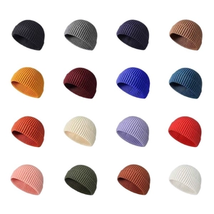 Multiple colors of ribbed knit beanie hats for men and women in various trendy shades