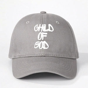Detailed close-up of CHILD OF GOD embroidery on grey cotton twill baseball cap
