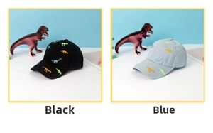 Detail of cute dinosaur embroidery on black and blue cotton baseball caps for kids