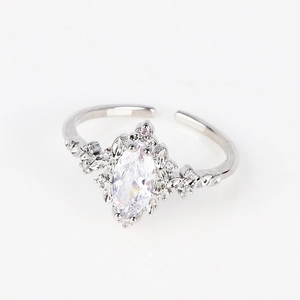 Close-up of marquise-cut zircon ring with hollow leaf edge and adjustable silver band