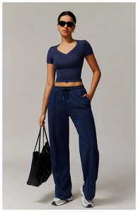 Women's dark blue wide-leg lounge set featuring V-neck tee and drawstring trousers