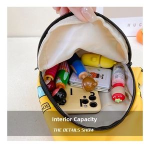 Internal capacity of yellow car cartoon chest bag showing phone and essentials