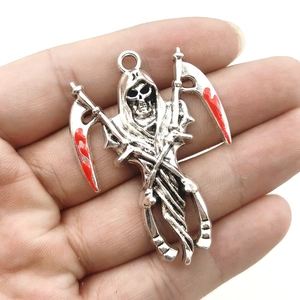 Retro silver Grim Reaper pendant with bloodied dual scythes held in a hand