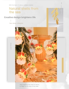 Close-up of warm yellow LED Christmas lights featuring decorative Santa Claus motifs