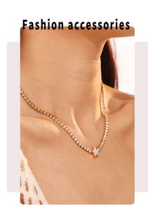Detailed view of a gold-plated star pendant necklace with zircons on a female model