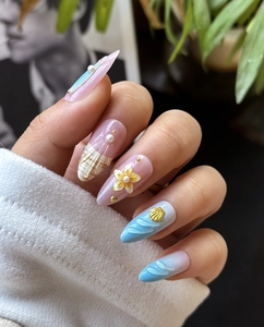 Detailed view of 3D shell and pearl accents on ocean-themed almond press-on nails
