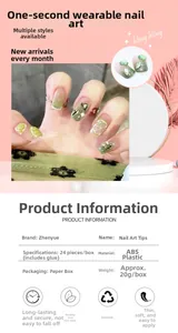 Detail of green and white gradient press-on nails with 3D lemon and heart accents