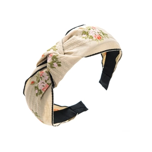 Serre-tête noué style ethnique avec broderie florale vintage sur tissu beige texturé