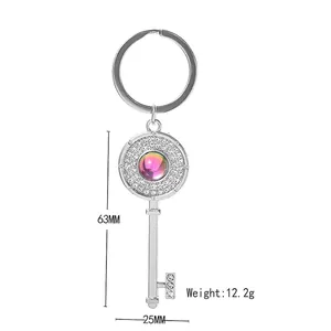 Silver vintage key keychain with gradient purple gemstone and sparkling rhinestones