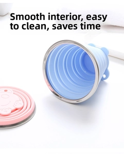 Macro shot of collapsible silicone cup with cartoon bear lid and stainless steel rim