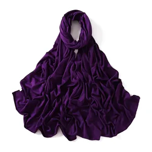 Detailed texture of dark purple modal jersey scarf showing soft fabric folds and drapes