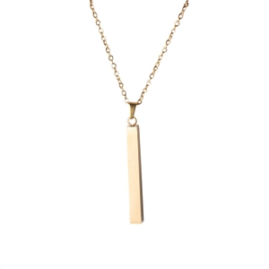 Detailed view of polished gold bar pendant necklace with sleek mirror finish on cuboid