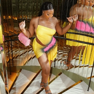 Detail of yellow spray-paint print mini dress with ruched texture and irregular hemline