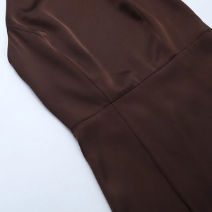 Detailed view of the waist seam and high-density fabric texture on this brown satin dress